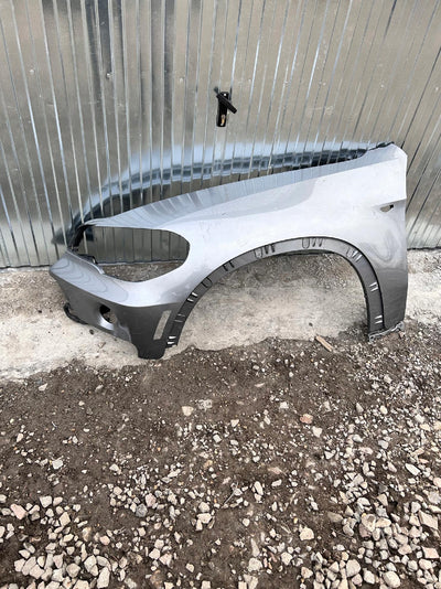 BŁOTNIK PRZEDNI LEWY BMW X5 E70 USA nr.000